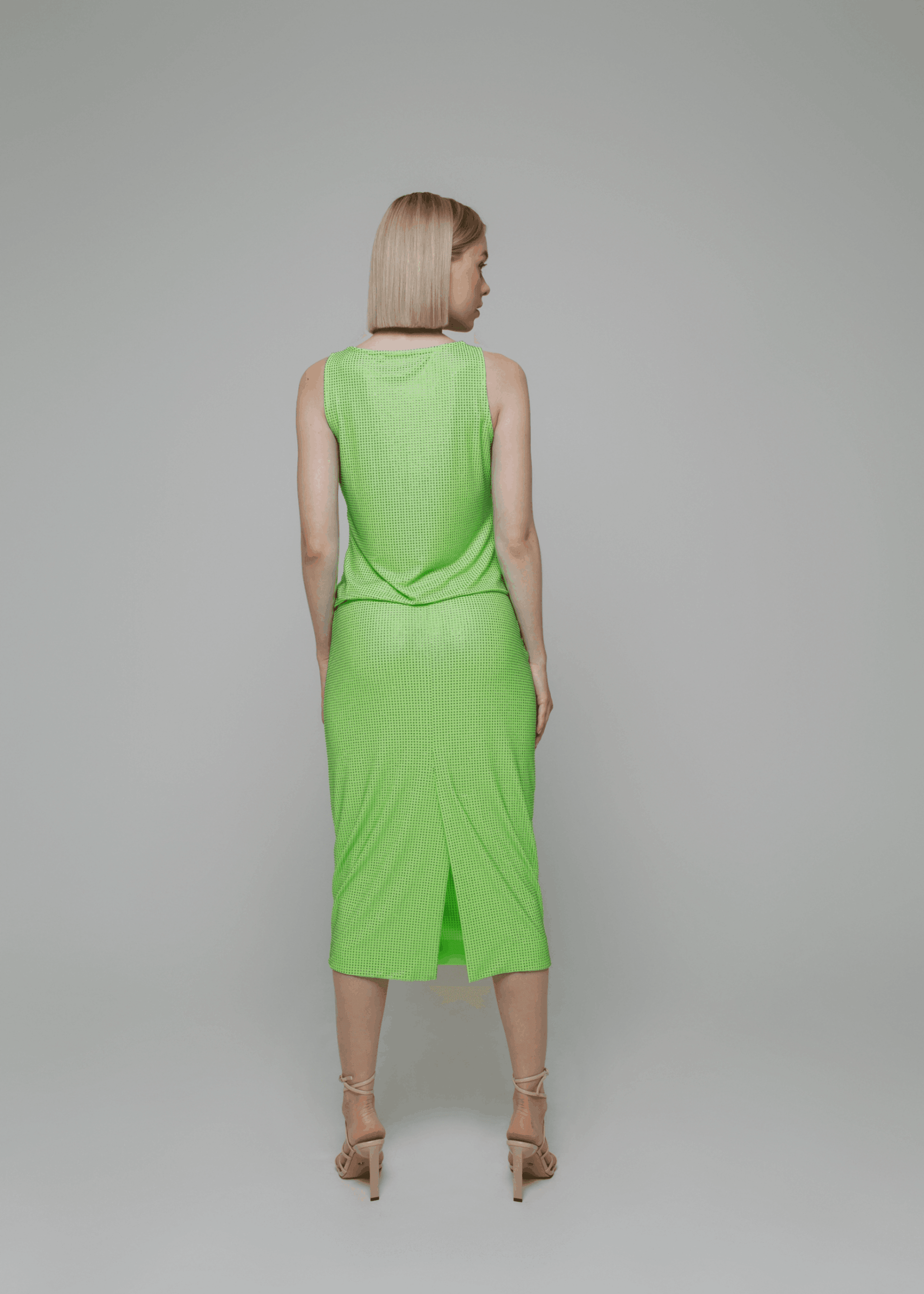 Exquisite detail of Crystal Pencil Skirt showcasing the fine craftsmanship and elegant design characteristic of Axinia Collection 's luxury collection.