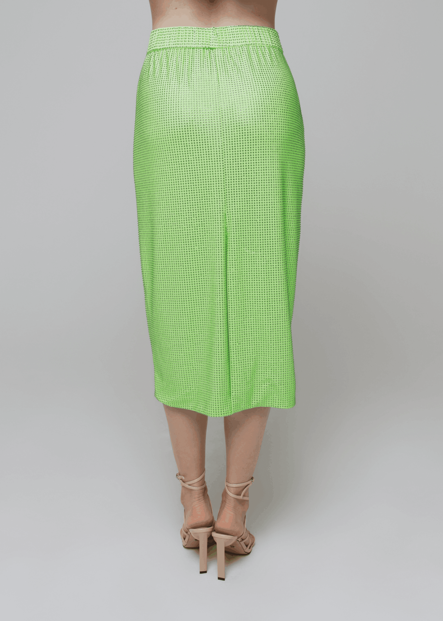 Exquisite detail of Crystal Pencil Skirt showcasing the fine craftsmanship and elegant design characteristic of Axinia Collection 's luxury collection.