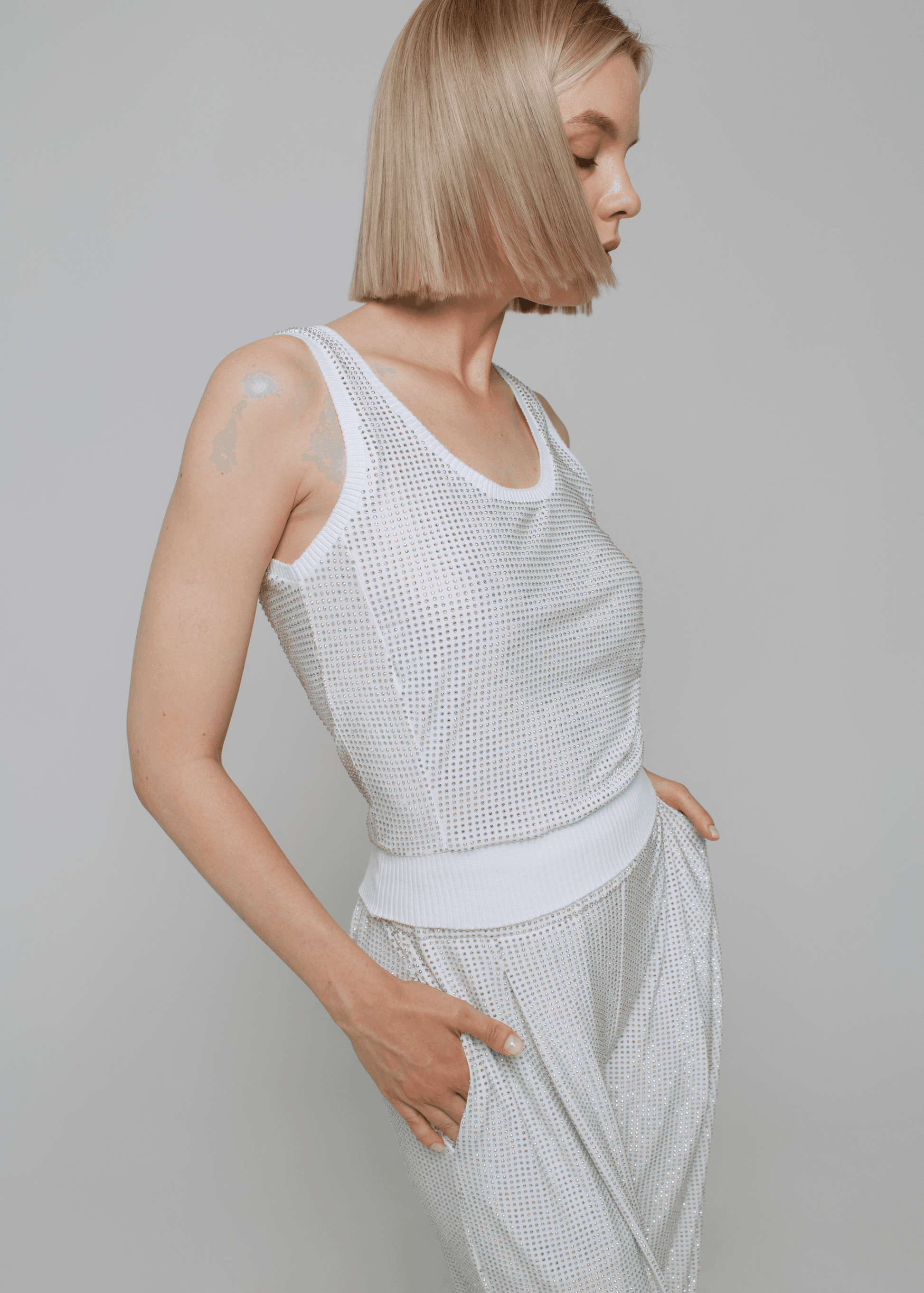 Exquisite detail of Crystal Tank Top showcasing the fine craftsmanship and elegant design characteristic of Axinia Collection 's luxury collection.