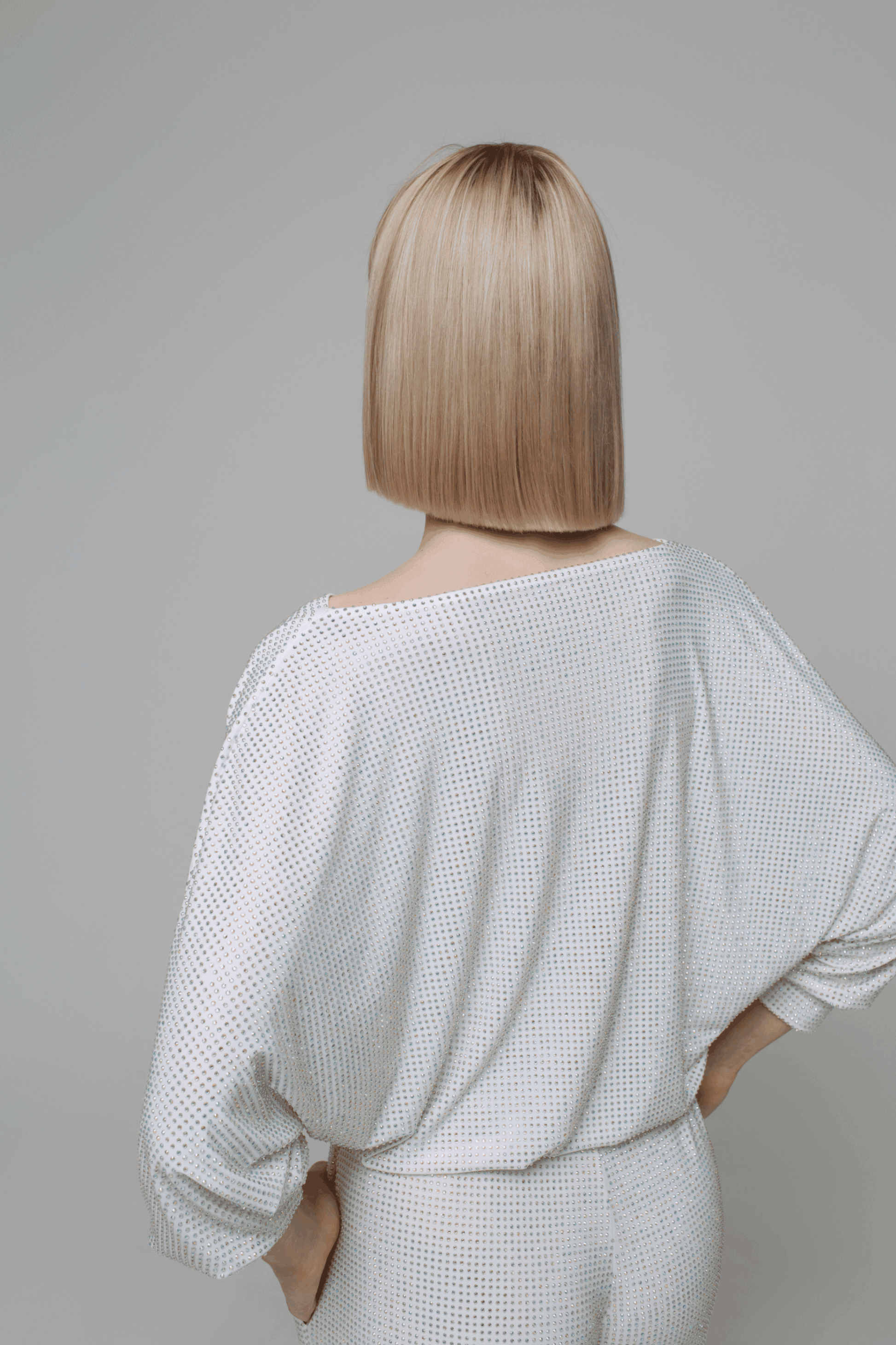 Exquisite detail of Crystal Cowlneck Three Quarter Dolman Sleeves showcasing the fine craftsmanship and elegant design characteristic of Axinia Collection 's luxury collection.