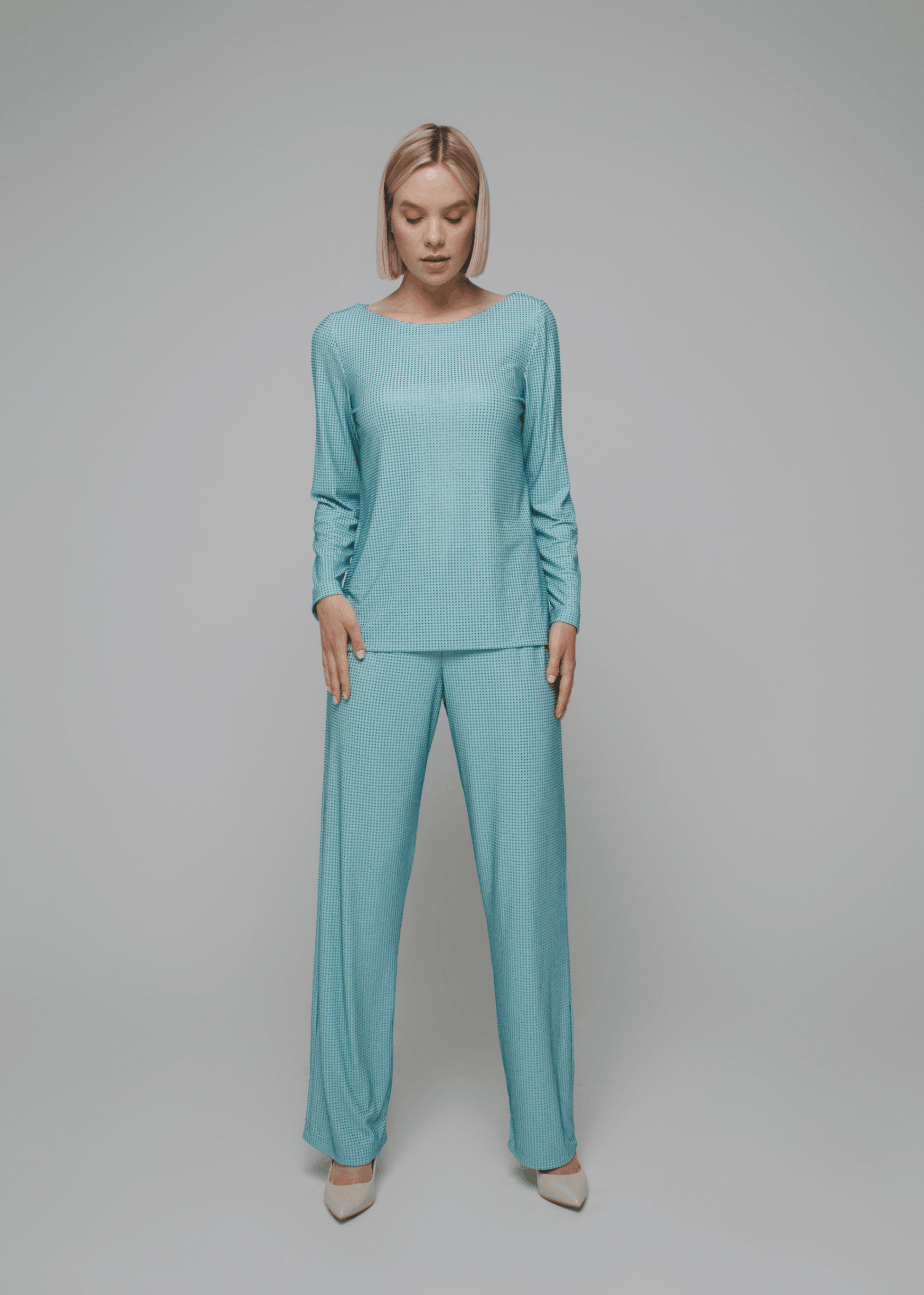 Exquisite detail of Crystal Long Sleeve Tunica Top showcasing the fine craftsmanship and elegant design characteristic of Axinia Collection 's luxury collection.