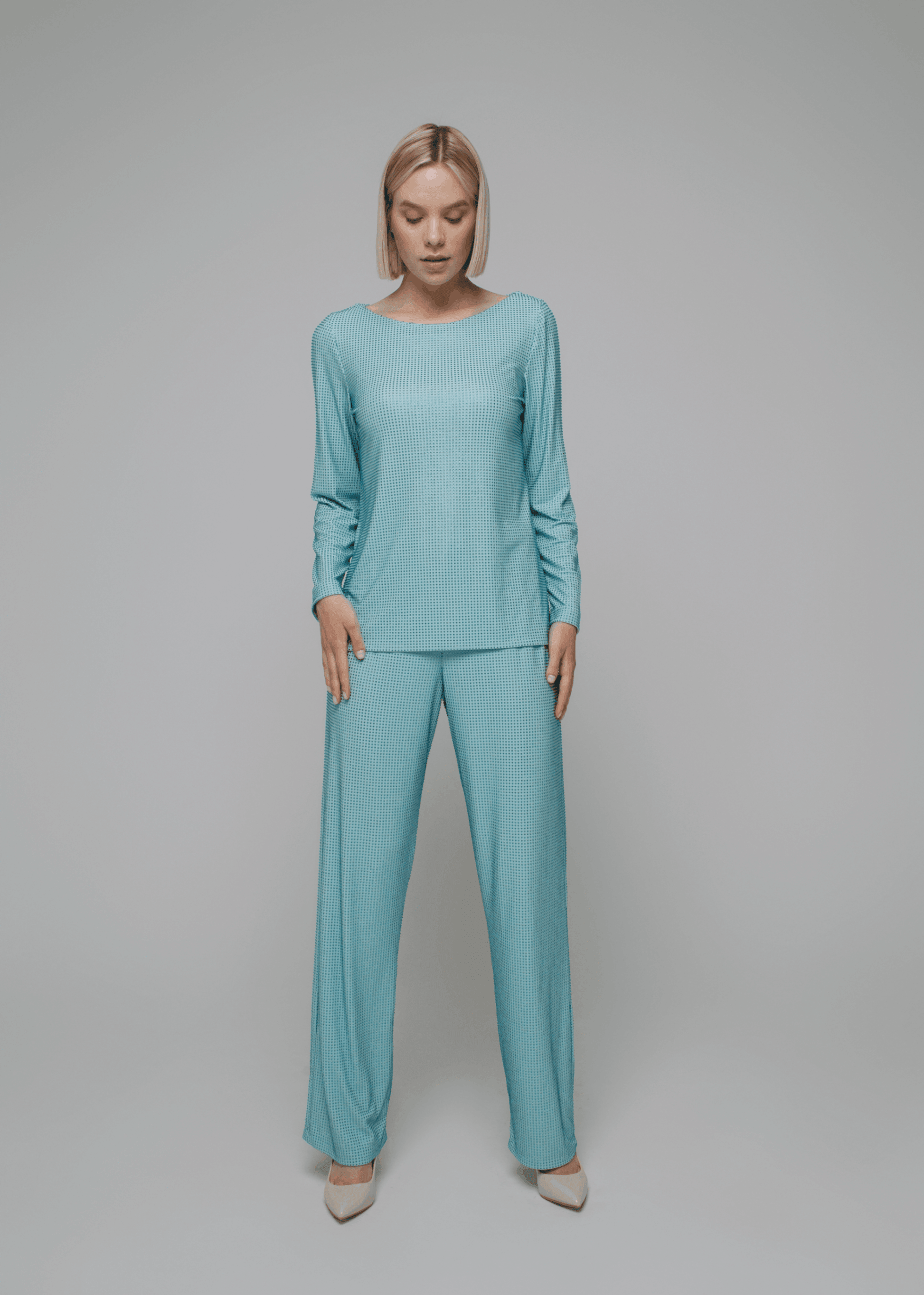 Exquisite detail of Crystal Trousers showcasing the fine craftsmanship and elegant design characteristic of Axinia Collection 's luxury collection.