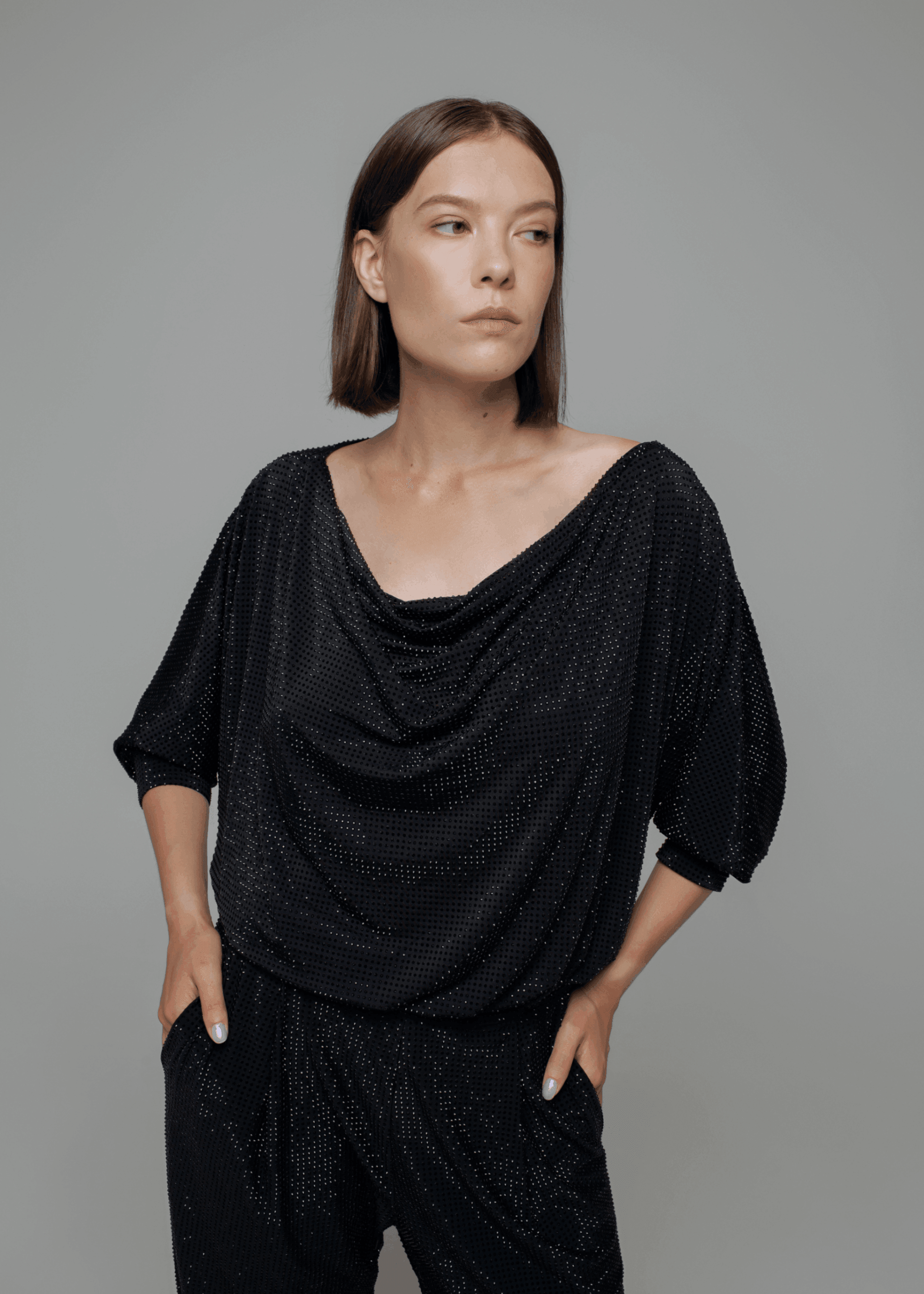 Exquisite detail of Crystal Cowlneck Three Quarter Dolman Sleeves showcasing the fine craftsmanship and elegant design characteristic of Axinia Collection 's luxury collection.