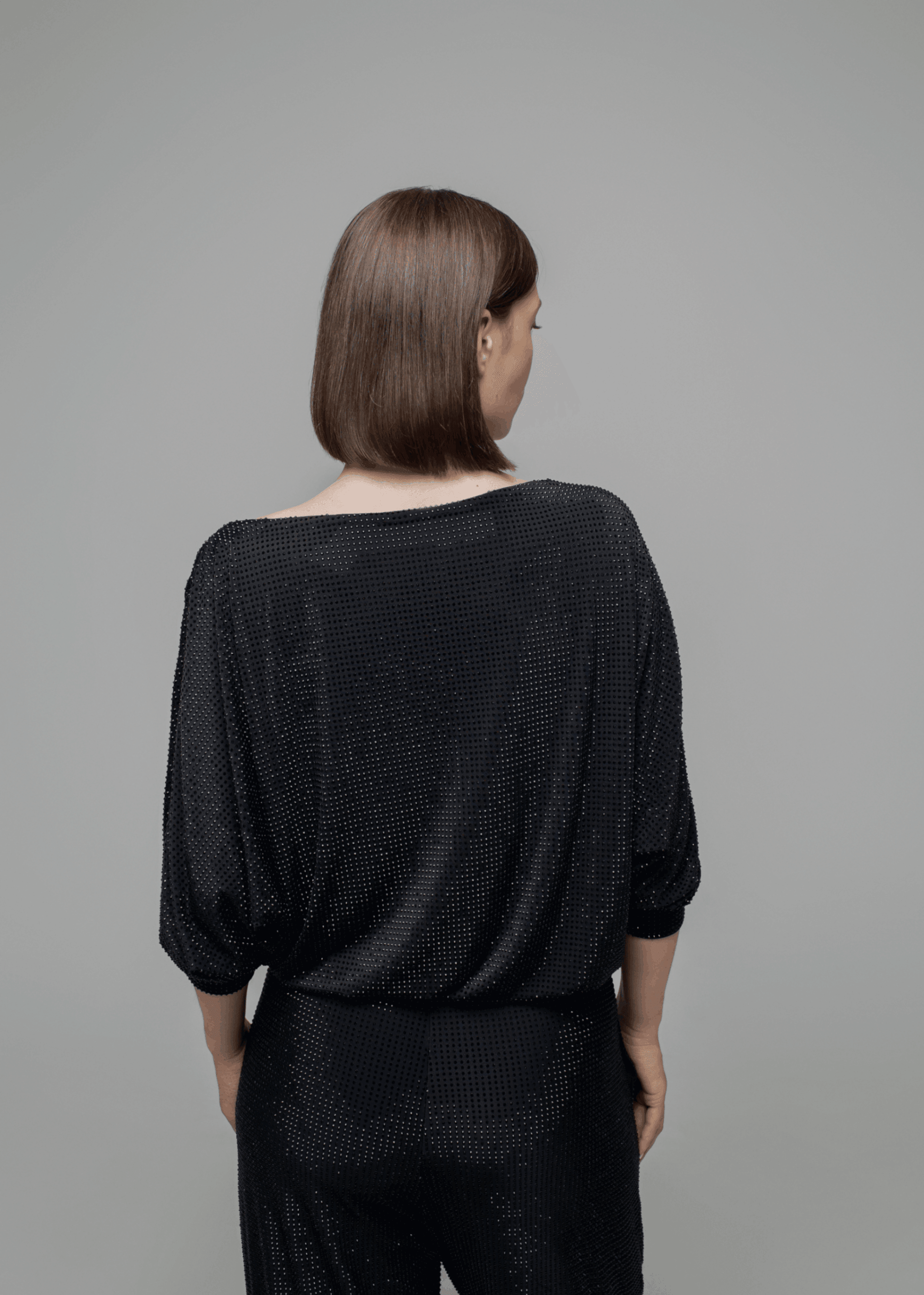 Exquisite detail of Crystal Cowlneck Three Quarter Dolman Sleeves showcasing the fine craftsmanship and elegant design characteristic of Axinia Collection 's luxury collection.