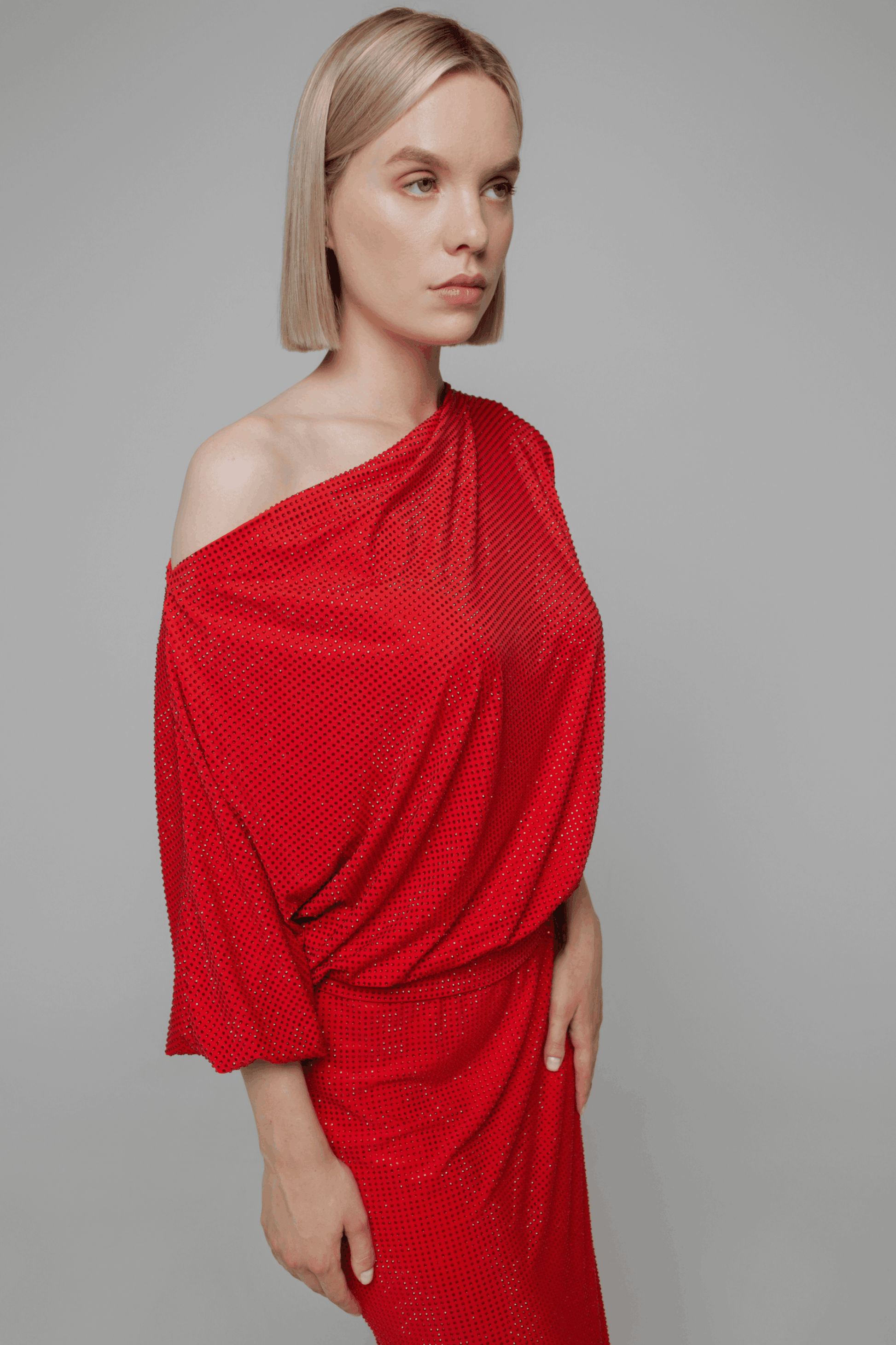 Exquisite detail of Crystal Cowlneck Three Quarter Dolman Sleeves showcasing the fine craftsmanship and elegant design characteristic of Axinia Collection 's luxury collection.