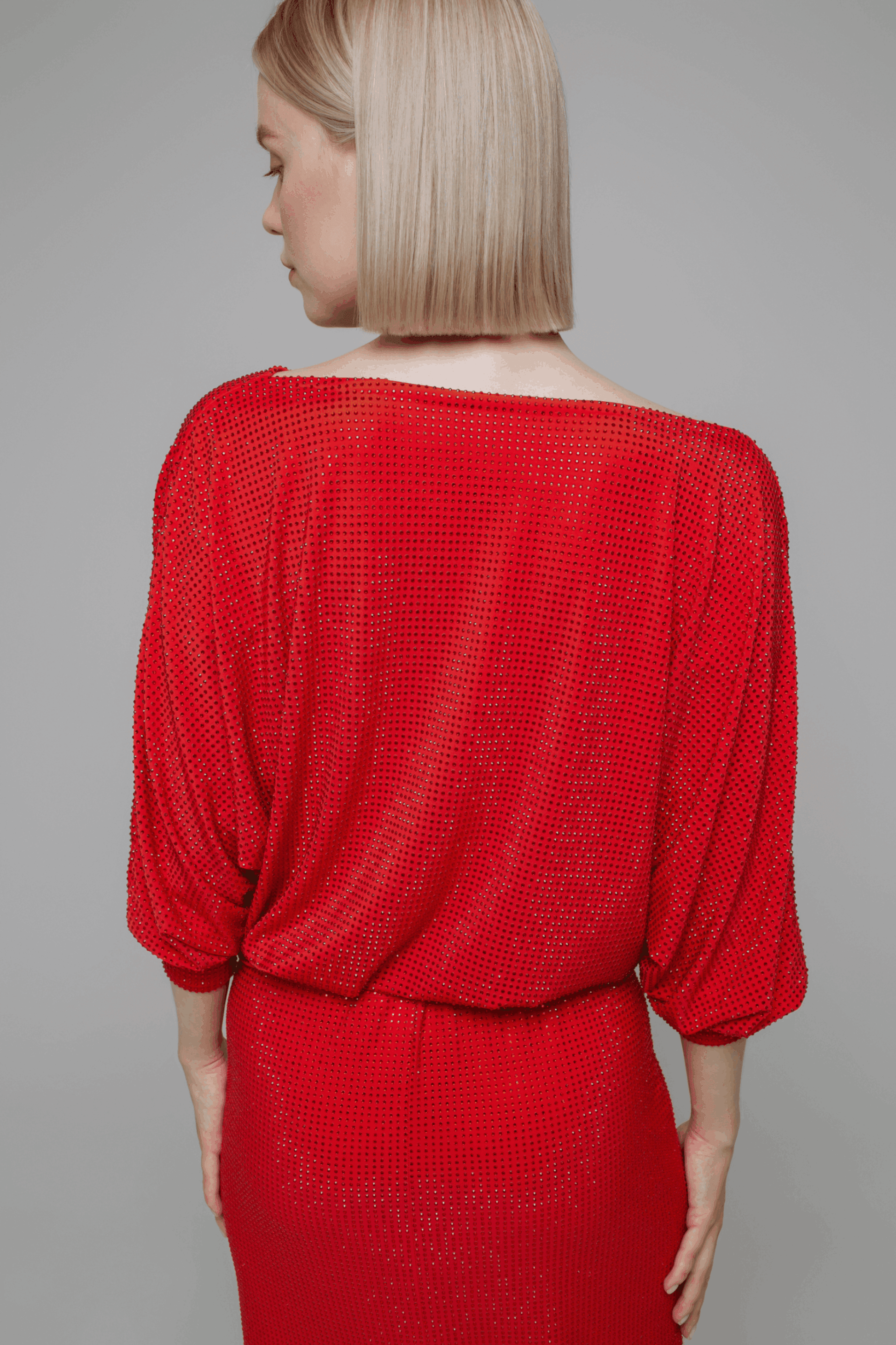 Exquisite detail of Crystal Cowlneck Three Quarter Dolman Sleeves showcasing the fine craftsmanship and elegant design characteristic of Axinia Collection 's luxury collection.
