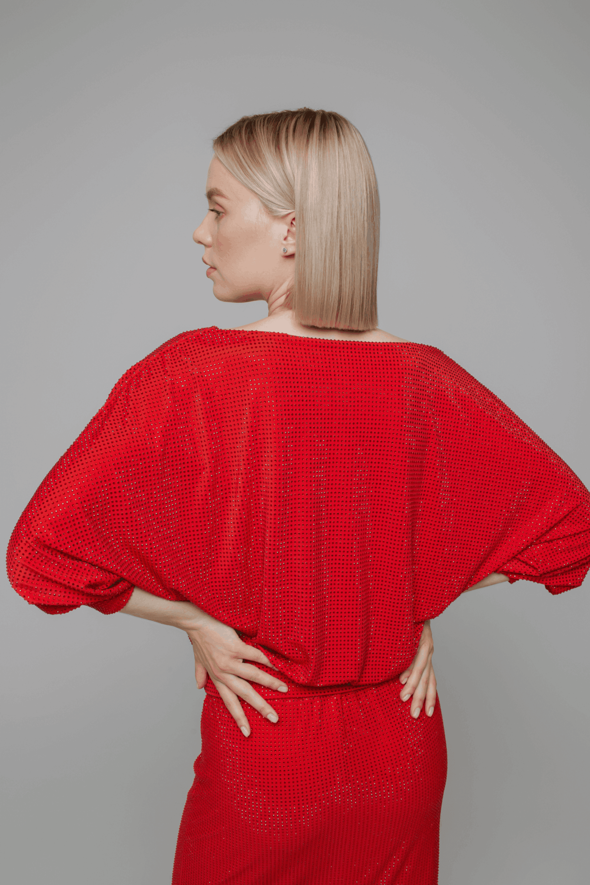 Exquisite detail of Crystal Cowlneck Three Quarter Dolman Sleeves showcasing the fine craftsmanship and elegant design characteristic of Axinia Collection 's luxury collection.