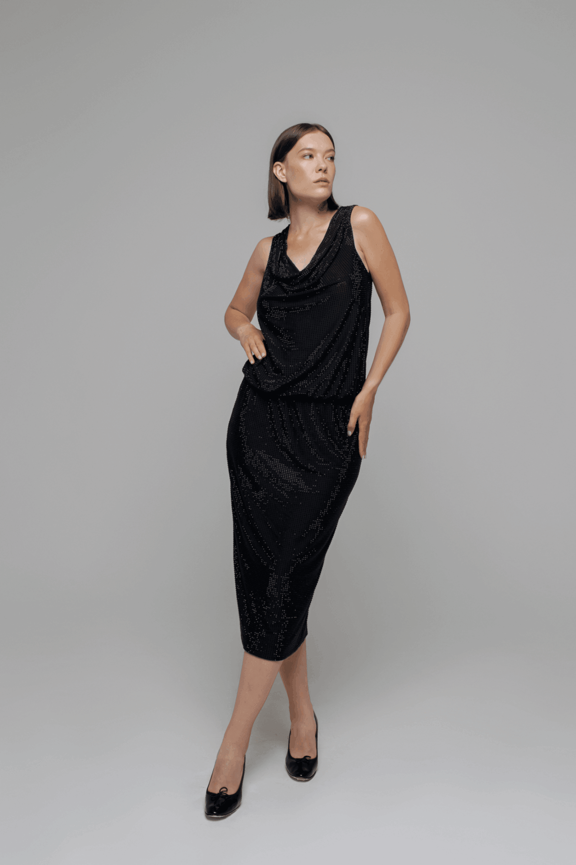 Exquisite detail of Crystal Pencil Skirt showcasing the fine craftsmanship and elegant design characteristic of Axinia Collection 's luxury collection.