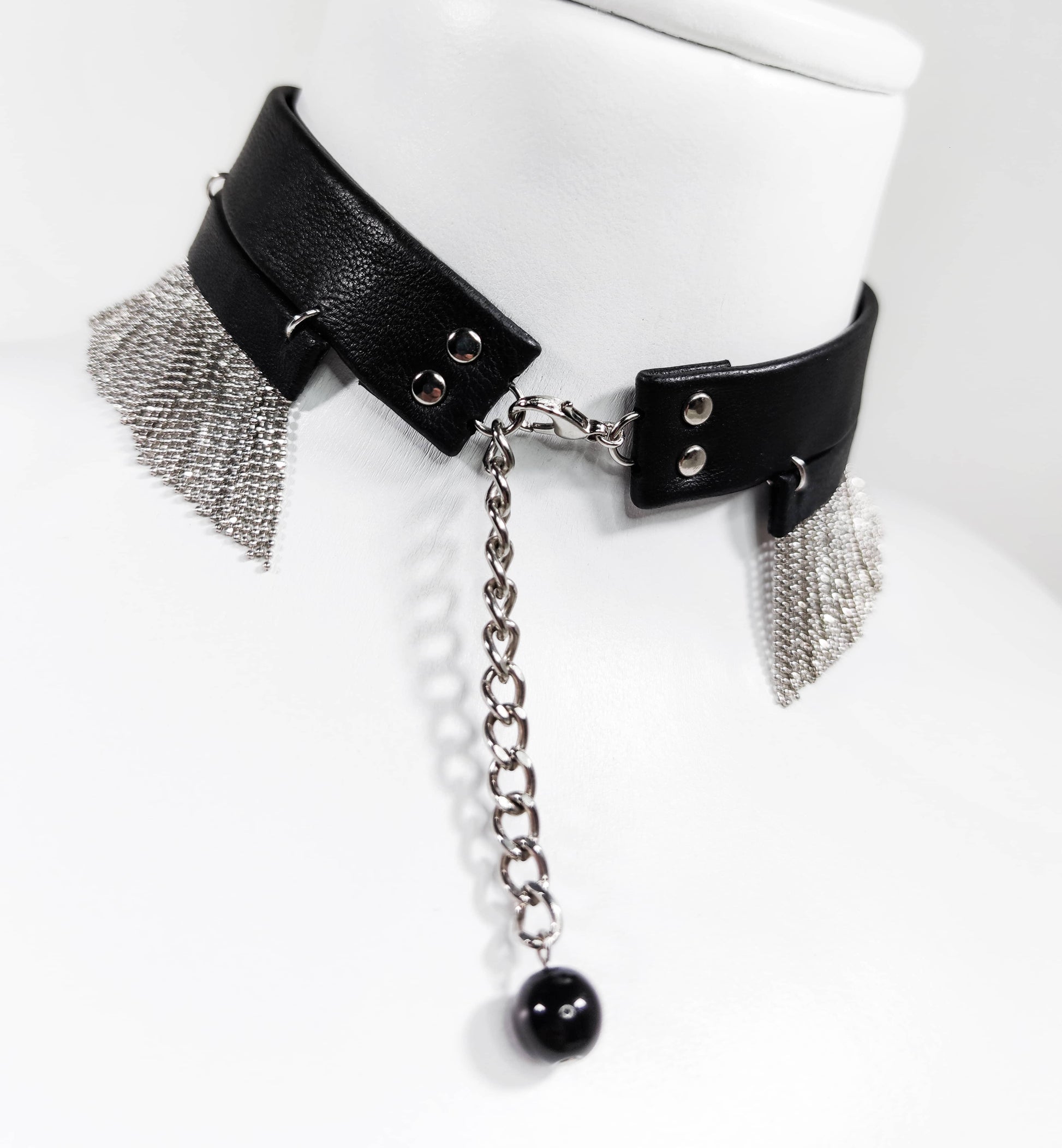 Exquisite detail of Short Leather Chocker with Chains showcasing the fine craftsmanship and elegant design characteristic of Axinia Collection 's luxury collection.