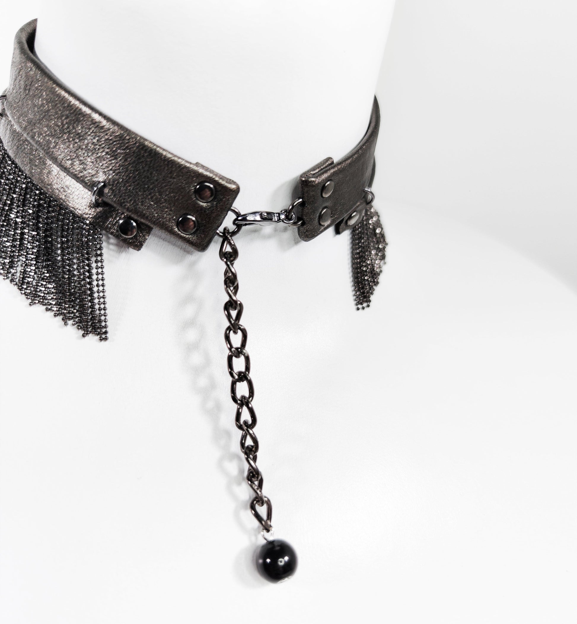 Exquisite detail of Short Leather Chocker with Chains showcasing the fine craftsmanship and elegant design characteristic of Axinia Collection 's luxury collection.