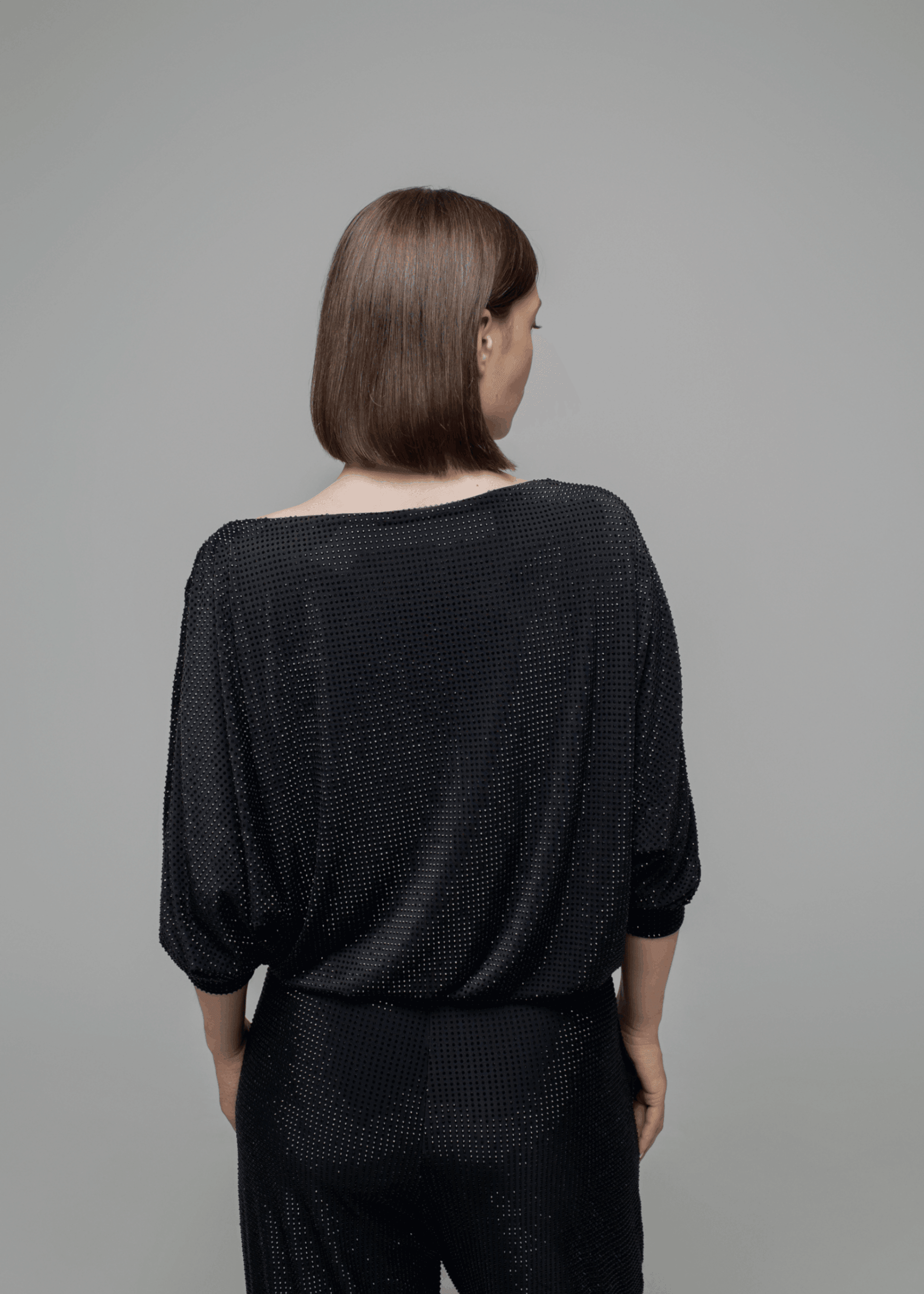 Exquisite detail of Axinia Crystal Cowlneck Three Quarter Dolman Sleeves showcasing the fine craftsmanship and elegant design characteristic of Axinia Collection 's luxury collection.