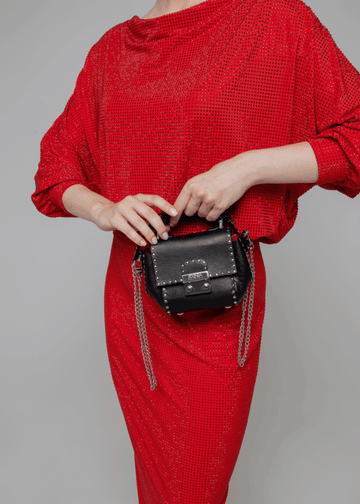 Exquisite detail of Axinia Mini Bag Riveted showcasing the fine craftsmanship and elegant design characteristic of Axinia Collection 's luxury collection.