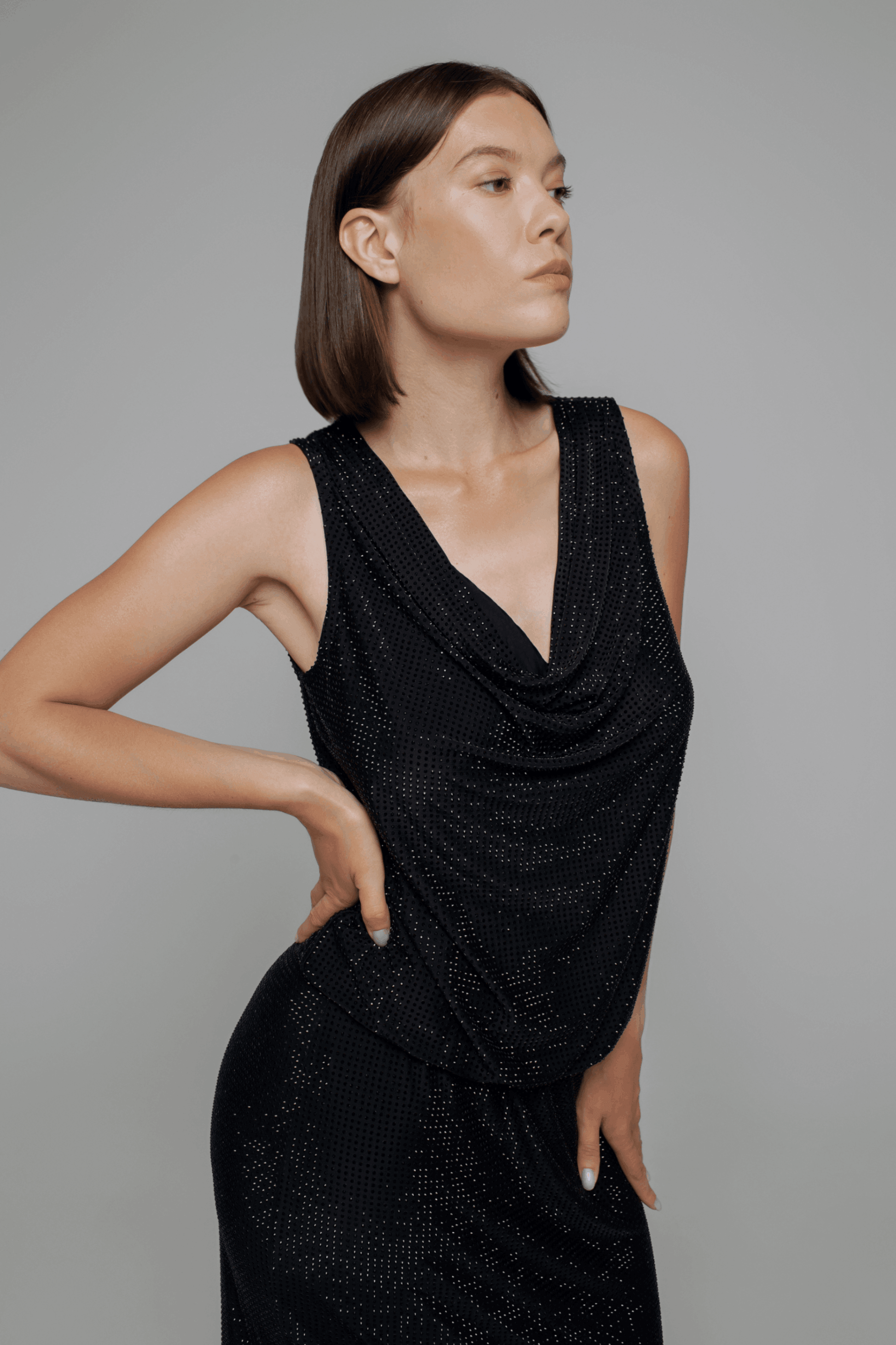 Exquisite detail of Crystal Cowlneck Sleeveless Top showcasing the fine craftsmanship and elegant design characteristic of Axinia Collection 's luxury collection.