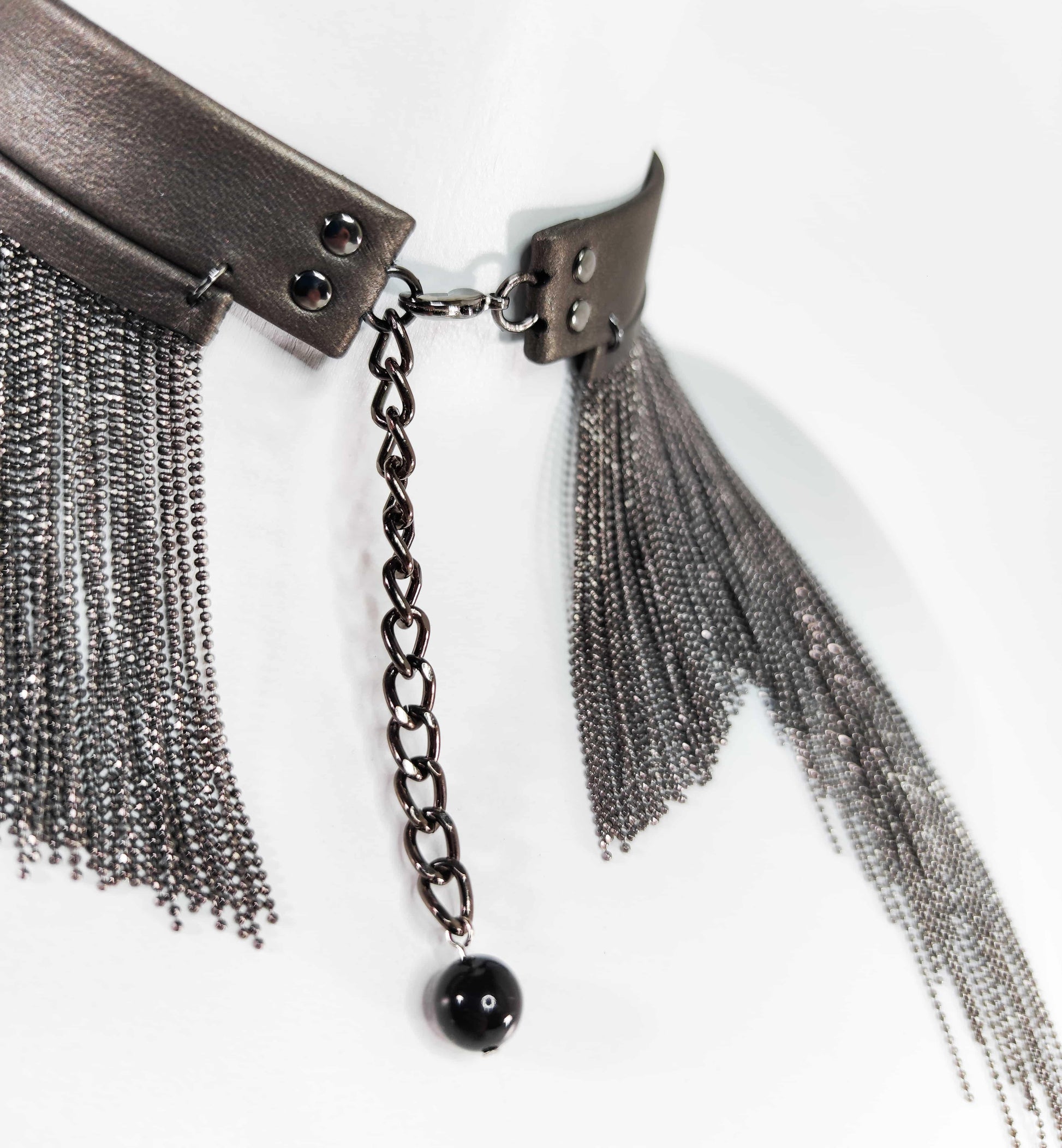 Exquisite detail of Long Leather Chocker with Chains showcasing the fine craftsmanship and elegant design characteristic of Axinia Collection 's luxury collection.