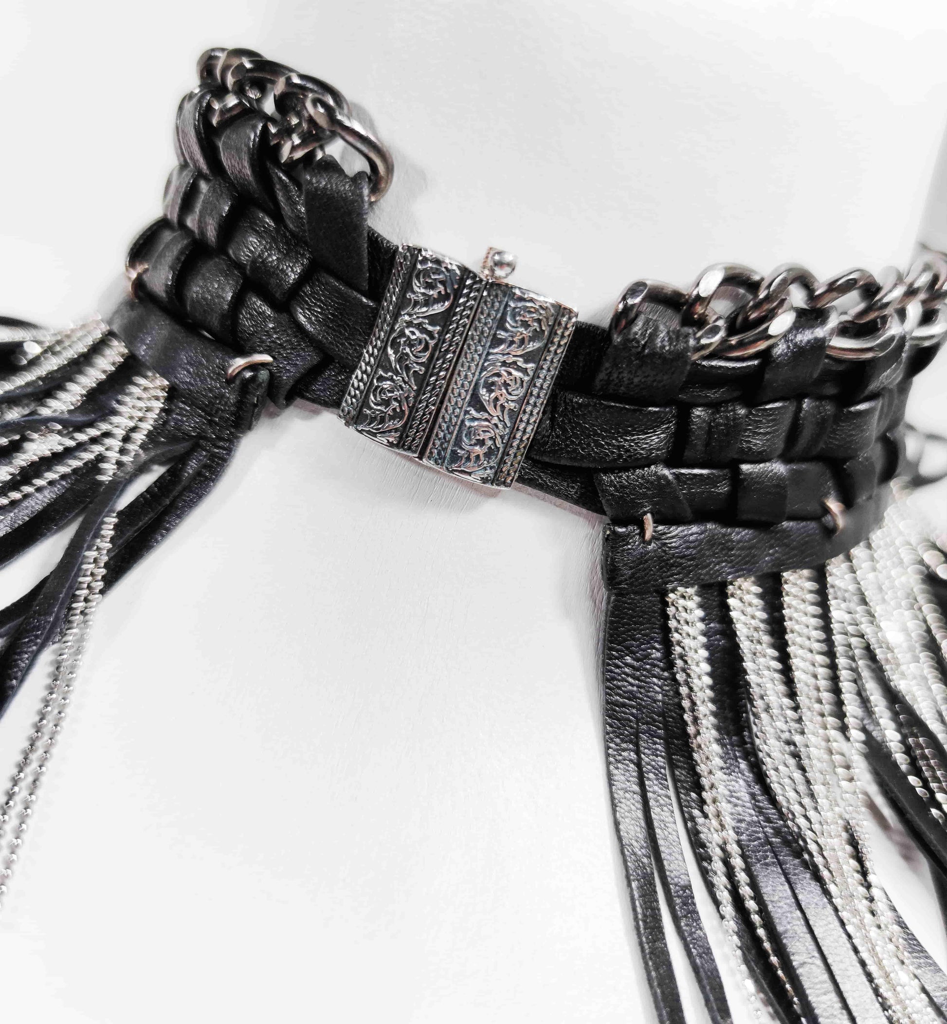 Exquisite detail of Axinia Long Braided Leather Chocker with Leather Fringe and Chains showcasing the fine craftsmanship and elegant design characteristic of Axinia Collection 's luxury collection.